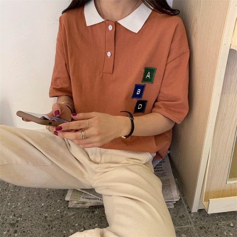 Damen-Poloshirt mit Patches